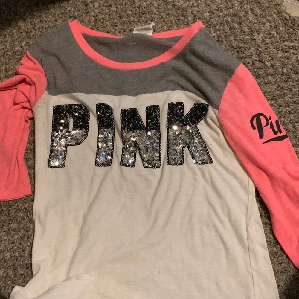 It’s pink and white and has sparkly lettering to small for me now